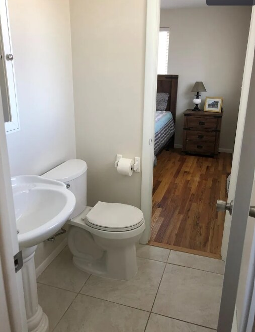 Powder bathroom with access from bedroom and kitchen