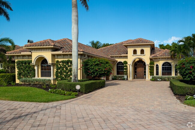 Colorful Single story mediteranean homes are abundant in this golf course community