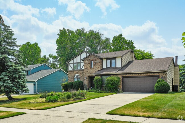 Many of the Tudor Revivals in Liberty Glen are split-level floorplan and partial-brick exterior.