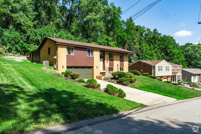 Wilkins Township homes are built along steep hillsides for unique neighborhood character.