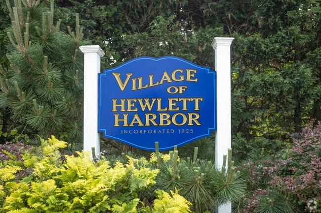 Signage welcomes you to the prestigious area known as the Village of Hewlett Harbor, NY.