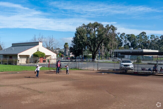 Families practice baseball at Lefty Gomez Recreation Area in Rodeo.