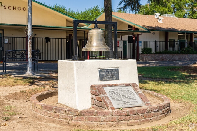 An old school bell is featured at the entrance to Kings River-Hardwick Elementary School.