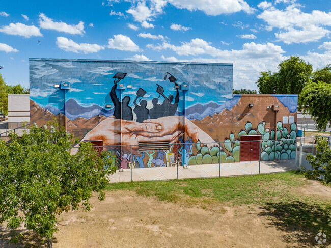 Holiday Park School features an elaborate mural on the side of the building.