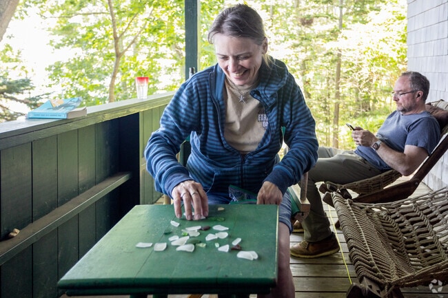 Residents relax on their front porch on Chebeague Island.