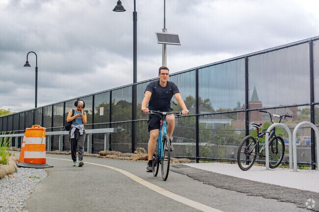 Bikers and pedestrians share the Community Path in Winter Hill on there way to the green line.