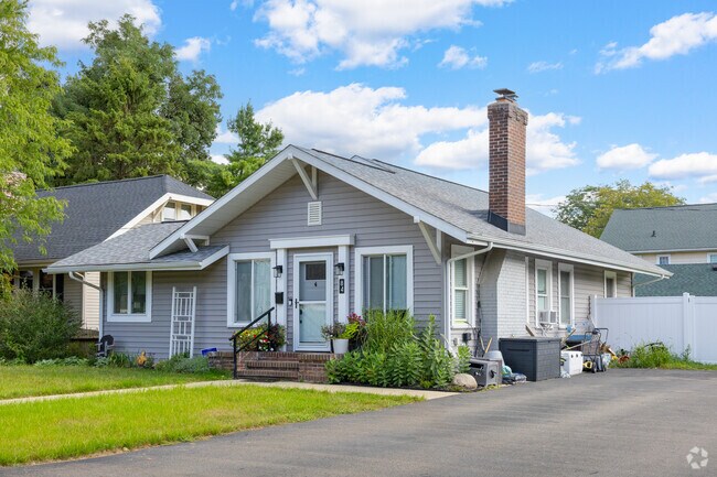 A charming single-family home boasts a well-manicured lawn, offering both comfort and curb appeal.