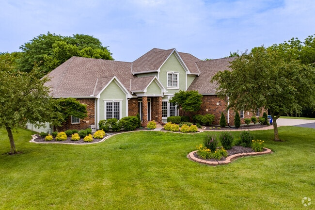 Single-family homes with large front yards and curb appeal are common in Lenexa.
