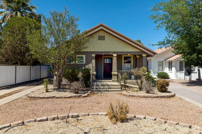 A charming Craftsman house with a cozy patio welcomes you to Constancia M. Palmer.