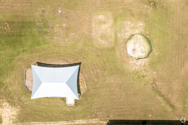 The covered play ground helps keep the equipment cool during the heat at New Caney Elementary.