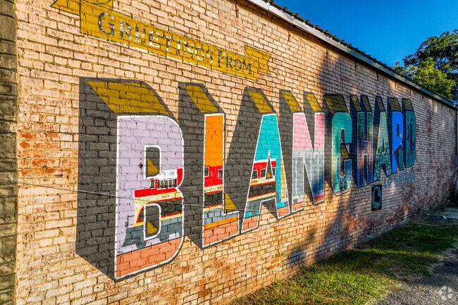 In the town of Blanchard is an artistic mural on the side of a building.