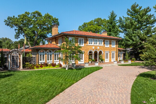Spanish inspired homes with stone driveways, arched doorways and windows reside in Westboro.