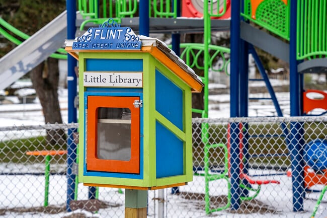 Swartz Creek Valley Park has a Little Library next to a park.