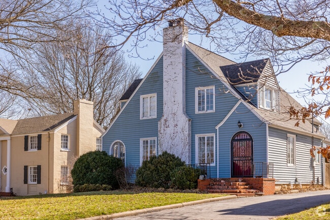Older homes sit beneath large trees in the Walnut Street neighborhood.