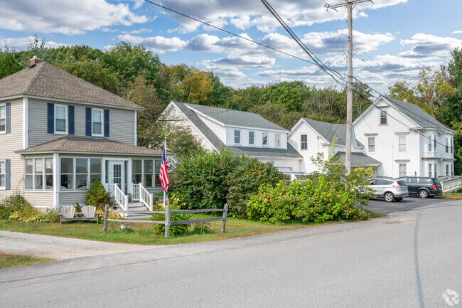 The American flag is displayed in the front lawn of a Howland home.