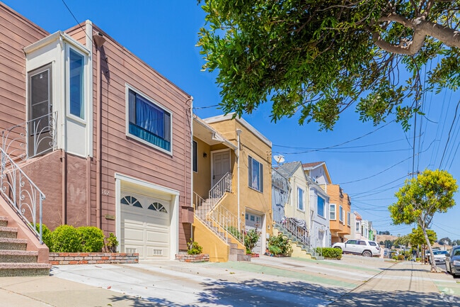 The valley floor of Bayshore is lined with attached stucco and Mediterranean-style homes.