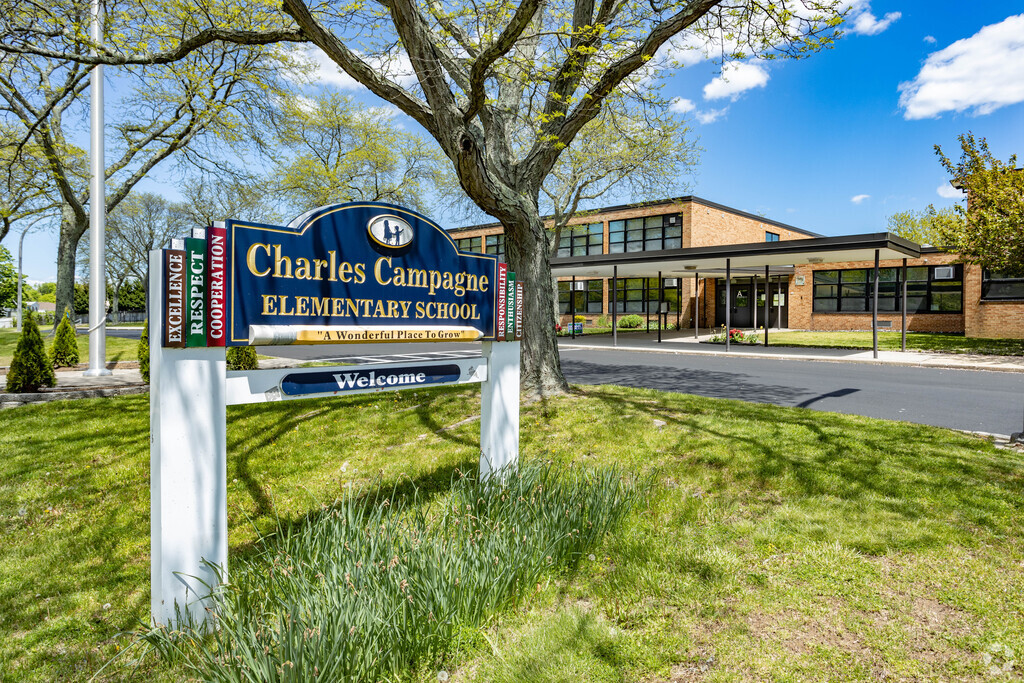The Charles Campagne Elementary School in Bethpage, NY is a beautiful sprawling building on a large green campus.