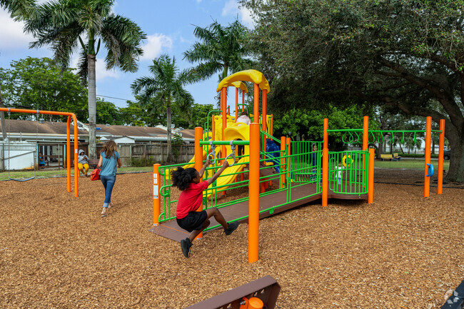 Children and residents enjoy a sunny afternoon at Sawyer Park.