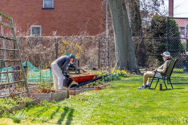 Lincoln-Lemington-Belmar residents work at the Highland Park Community Garden.