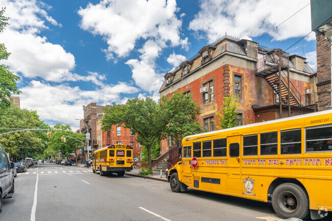 School buses line the streets in front of Bais Yakov of D'Khal Adas Yereim.