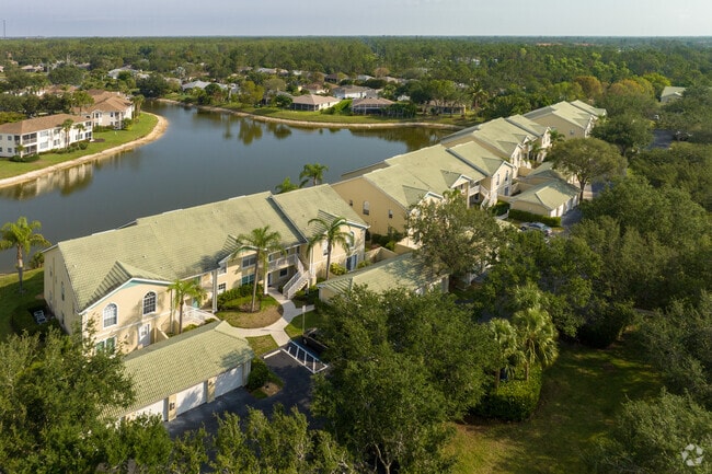 Two story waterfront condominium homes with detached garages in the Council neighborhood in Bonita Springs, FL