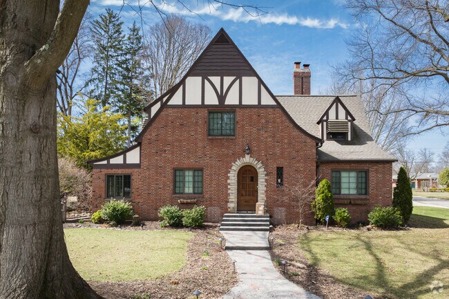 This Kenmore Tudor home features a beautifully arched front door.