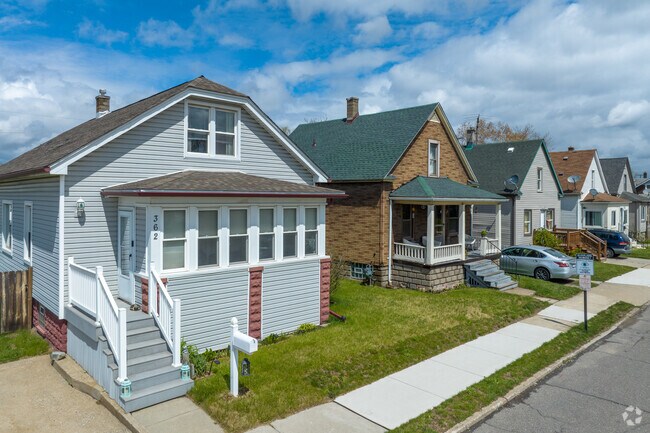 The sidewalks on residential streets in River Rouge helps make the area walkable.