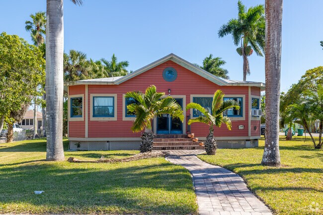 Colorful bungalow-style home reflects classic Old Florida architecture.