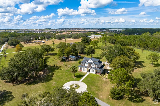 Centuries-old oak trees and lush native landscaping is all part of the charm of Happy Trails.