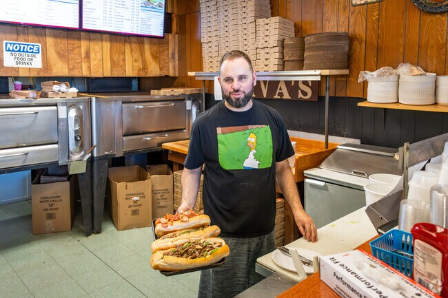 Savor a delicious steak and cheese grinder at Sava's Pizza in Somerset Historic Village, MA.