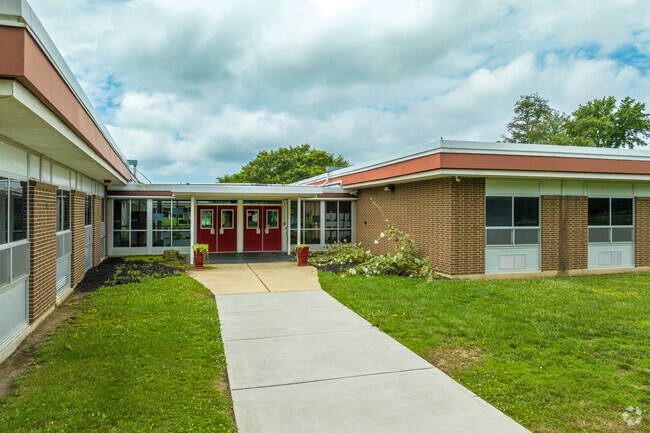 The school's red brick facade is a familiar sight in the Carneys Point community.