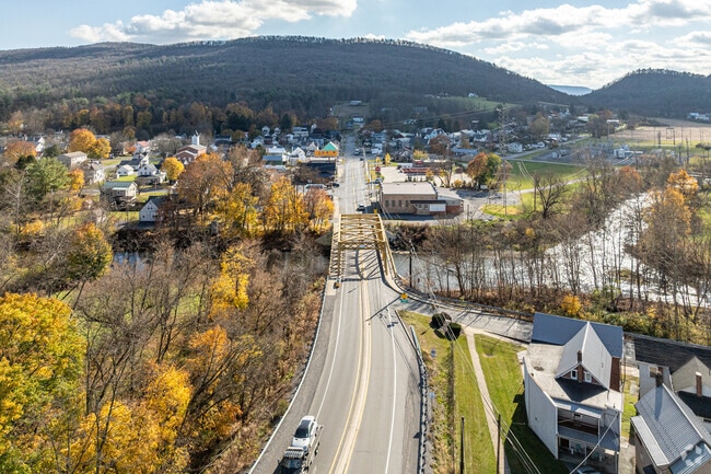 The afternoon sun peeks over the ridge as folks make their way to and from Union.