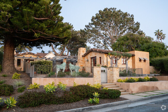 This custom build Mediteranean home is within walking distance of the beach.