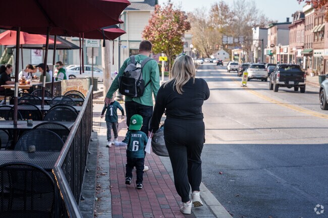A young family takes a stroll along Lancaster Ave in the heart of Downingtown.