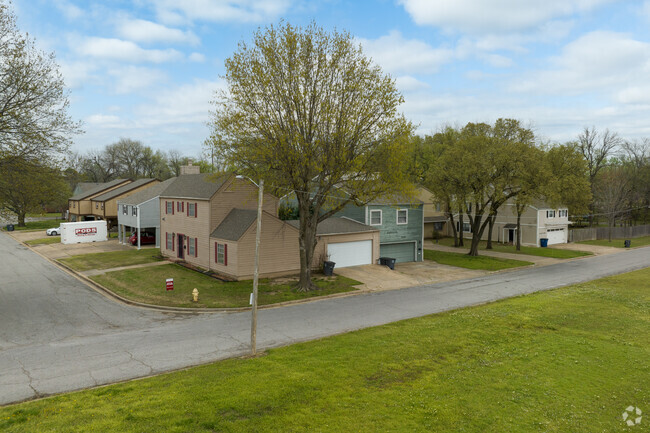 Row of homes in the Audubon neighborhood line a quiet street.