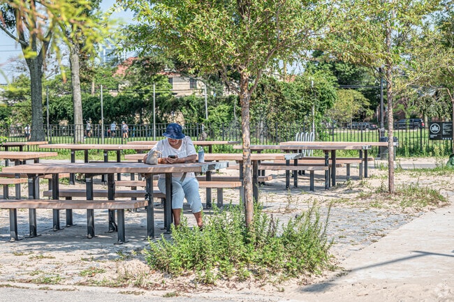 Some choose to sit in the shade at Manhattan Beach Park.