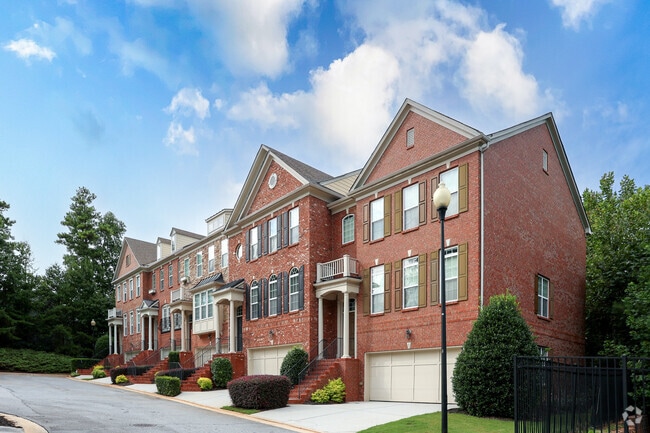 Multi-story townhomes in Vinings feature attached garages.