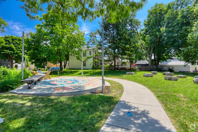 A walking path runs past the small stage in Paliafito Park in Walker's Point.