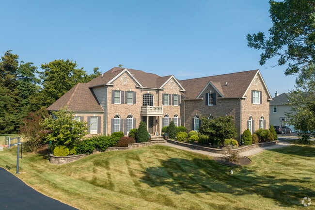 Guests to this large, brick home in Chadds Ford are greeted by a federalist-style portico.