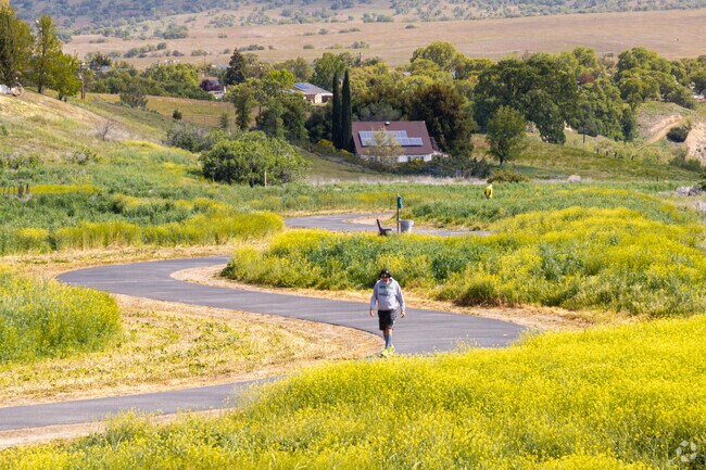 Local residents enjoy walking the paved trail around Meadowbrook Park.