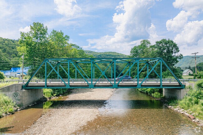 Locals drive across Ottauquechee River as they make their way into the rural parts of Bridgewater.