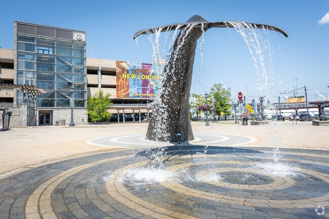 Take a picture by the Whale Tale water fountain at Waterfront Park in Downtown New London, CT.