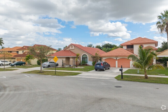 Admire Spanish-style homes: Architectural beauty in Hillsboro Ranches.