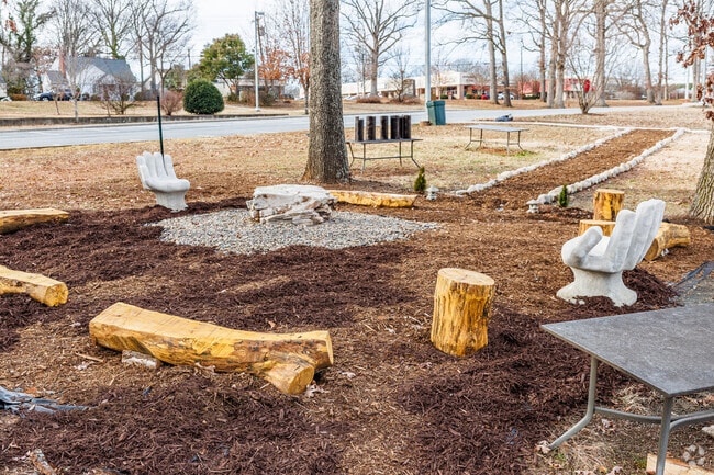 The hand sculpture seats at Moore Elementary are a perfect spot to sit and read.