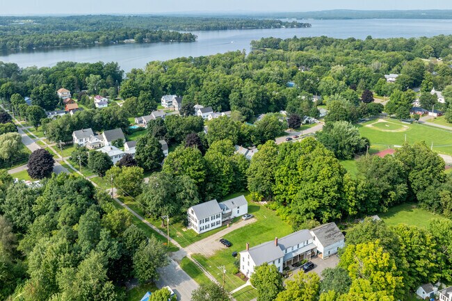 A group of homes with Witham Park and Lake Sebasticook in the background.