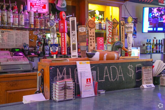 Welcoming friends enjoy delicious food at Decoy restaurant and bar in downtown Linnton.