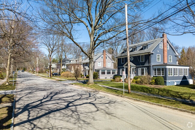 Wide streets are tree-lined in the Summit, NJ, neighborhood.