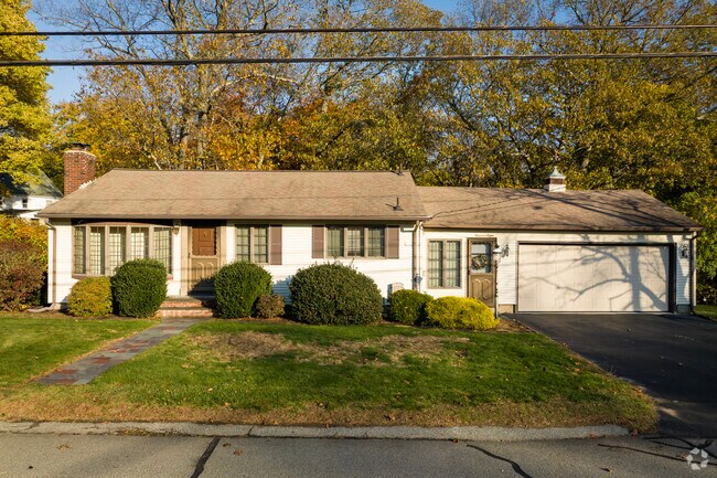 Modest ranch-style homes make appearances on the shaded streets of Centreville.