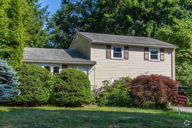 Other home options in Saxonville include colonials with landscape.