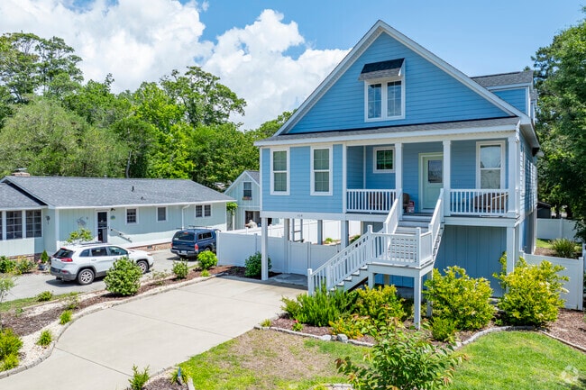 Surfside Beach showcases new traditional homes, blending classic charm with modern coastal design in this vibrant seaside community.